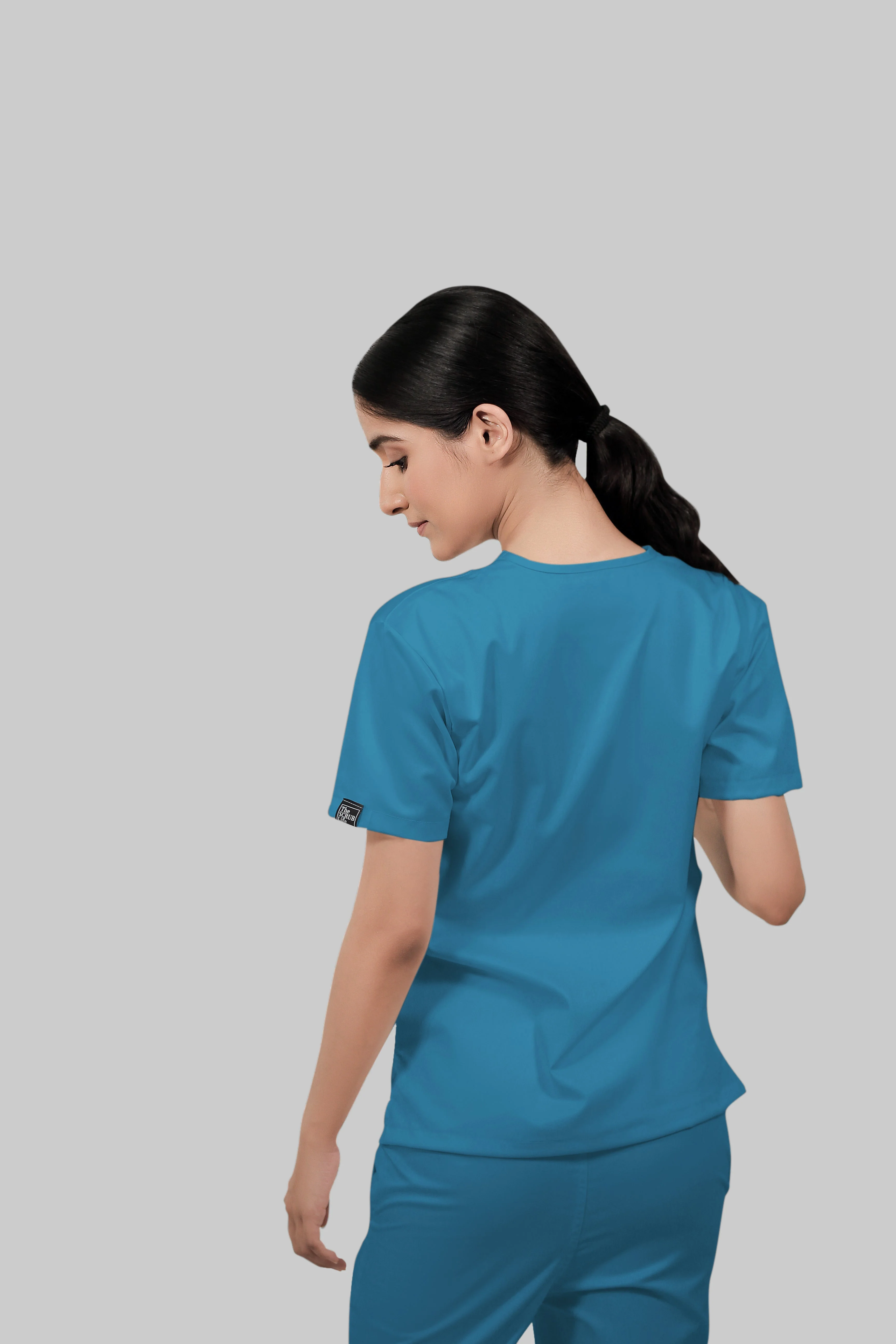 Stretchable (2Way) Women Peacock Blue V-Neck With Jogger Scrub Set - Image 2